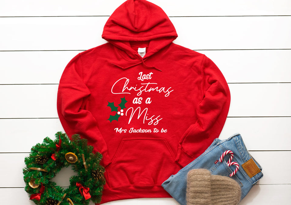 Personalised Last Christmas as a Miss holly print Christmas hoody - your surname - red